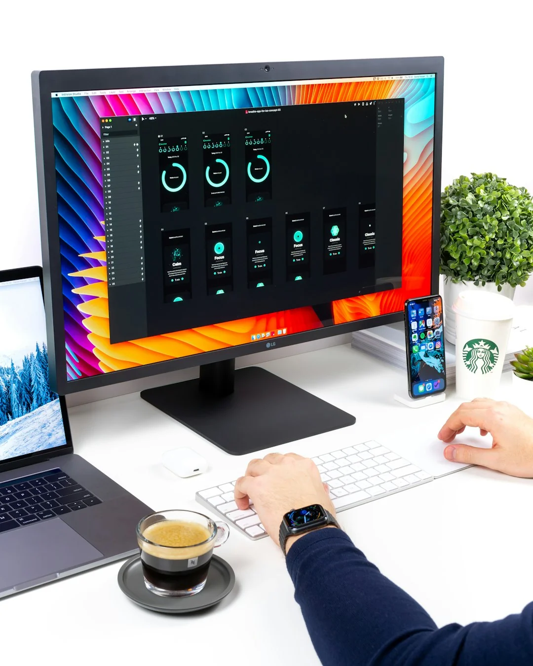 A contemporary workspace showcasing a laptop, tablet, and smartphones, ideal for tech and freelance use.